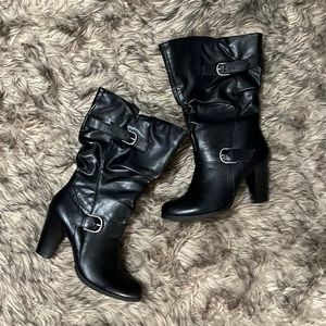 Black faux-leather chunky heel boot with silver buckle detail and zip closure